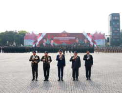 Jokowi and Prabowo Subianto Inspecting Troops at Presidential Inauguration Security Ceremony while Riding Together in Pindad Jeep