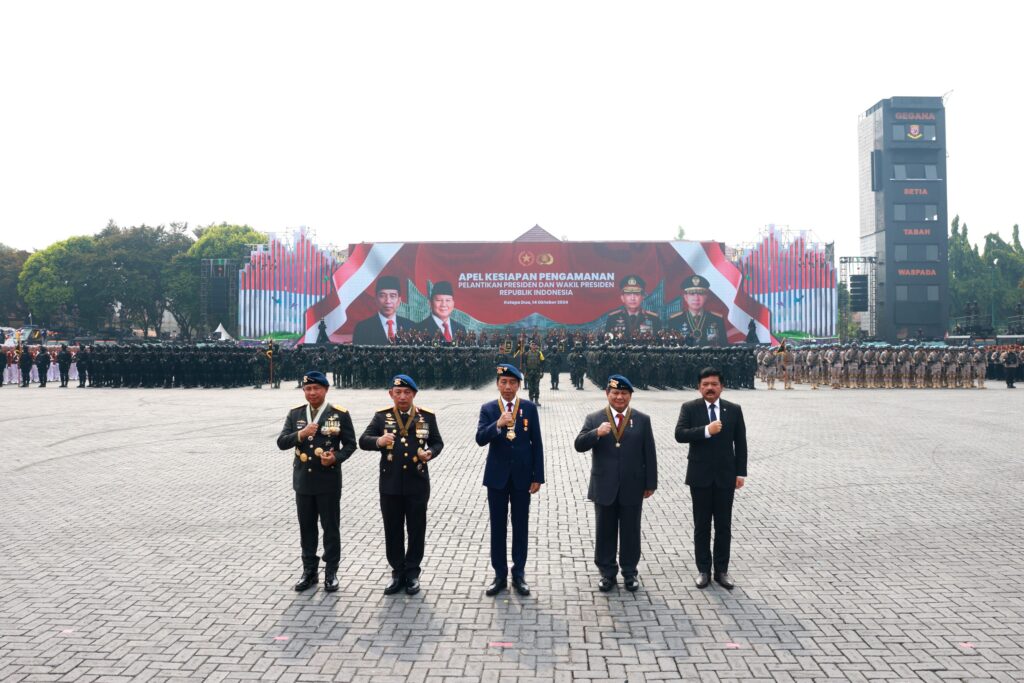 Jokowi and Prabowo Subianto Inspecting Troops at Presidential Inauguration Security Ceremony while Riding Together in Pindad Jeep